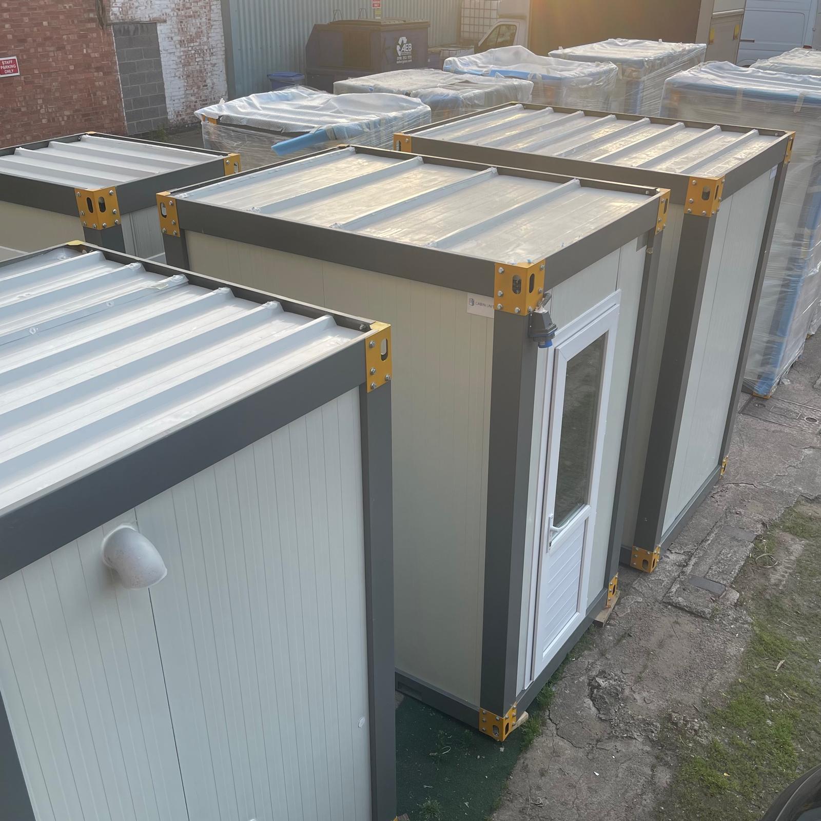 Portable kiosk cabin wall paneling and window installation